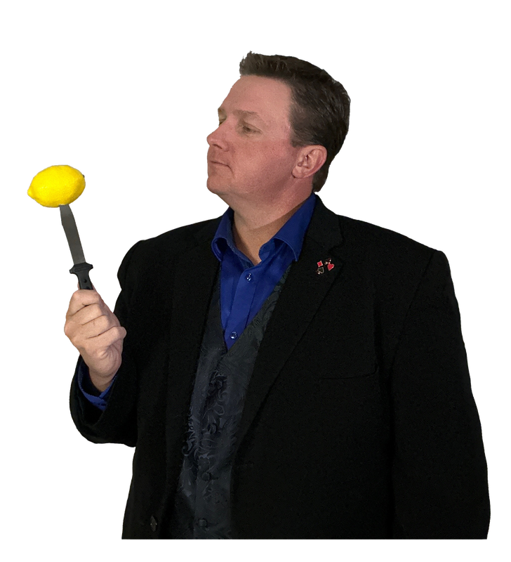Jeff holding a lemon on a knife